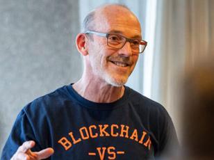Man in a blockchain tee shirt