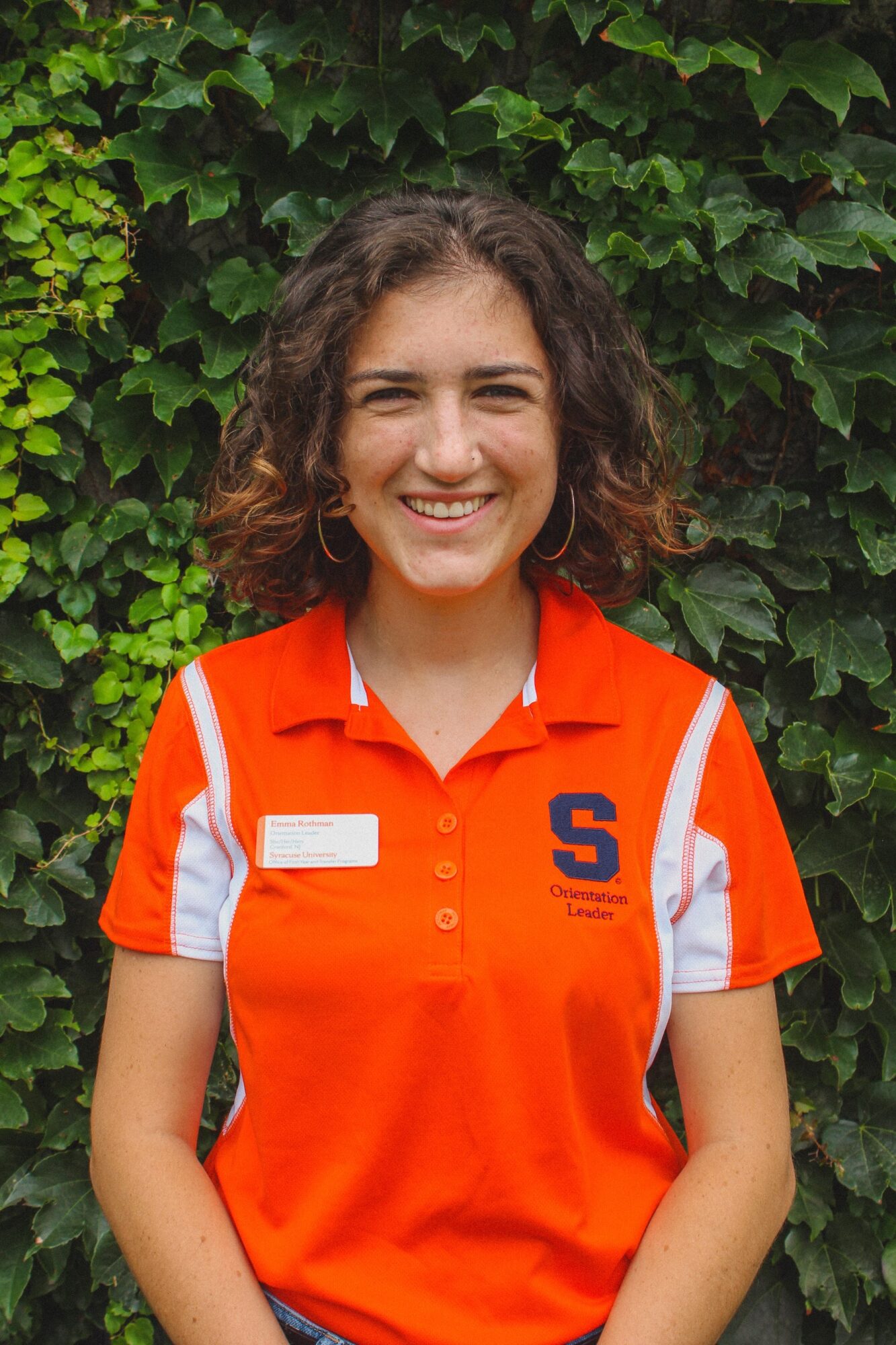 SU student Emma Rothman in an orange SU student