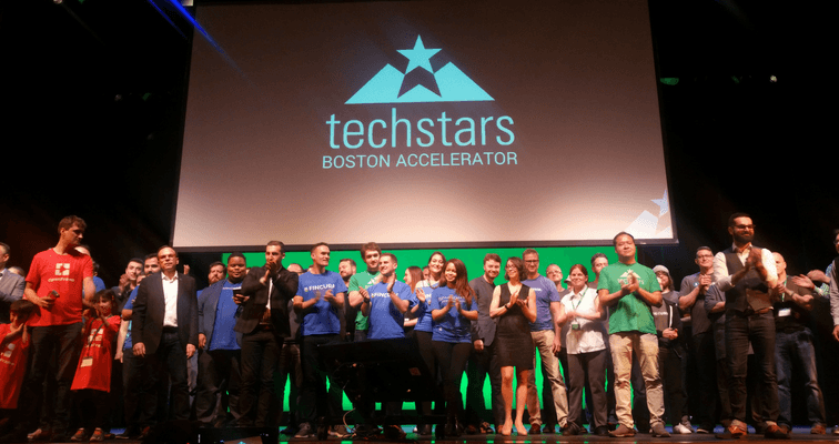 group of startup founders on a stage
