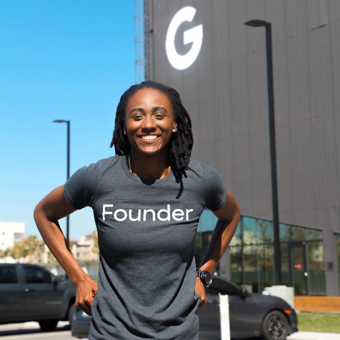 entrepreneur in a founders shirt in front of Google building