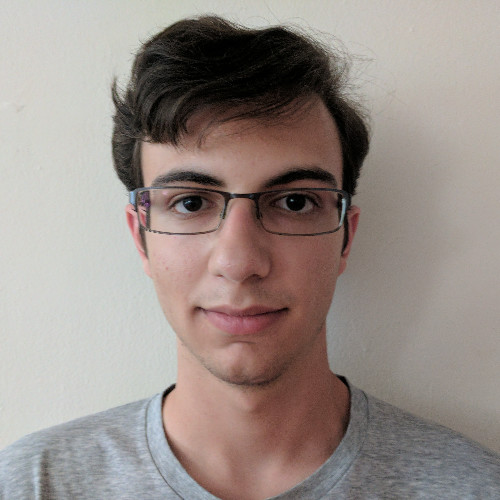 headshot of a student against a white wall