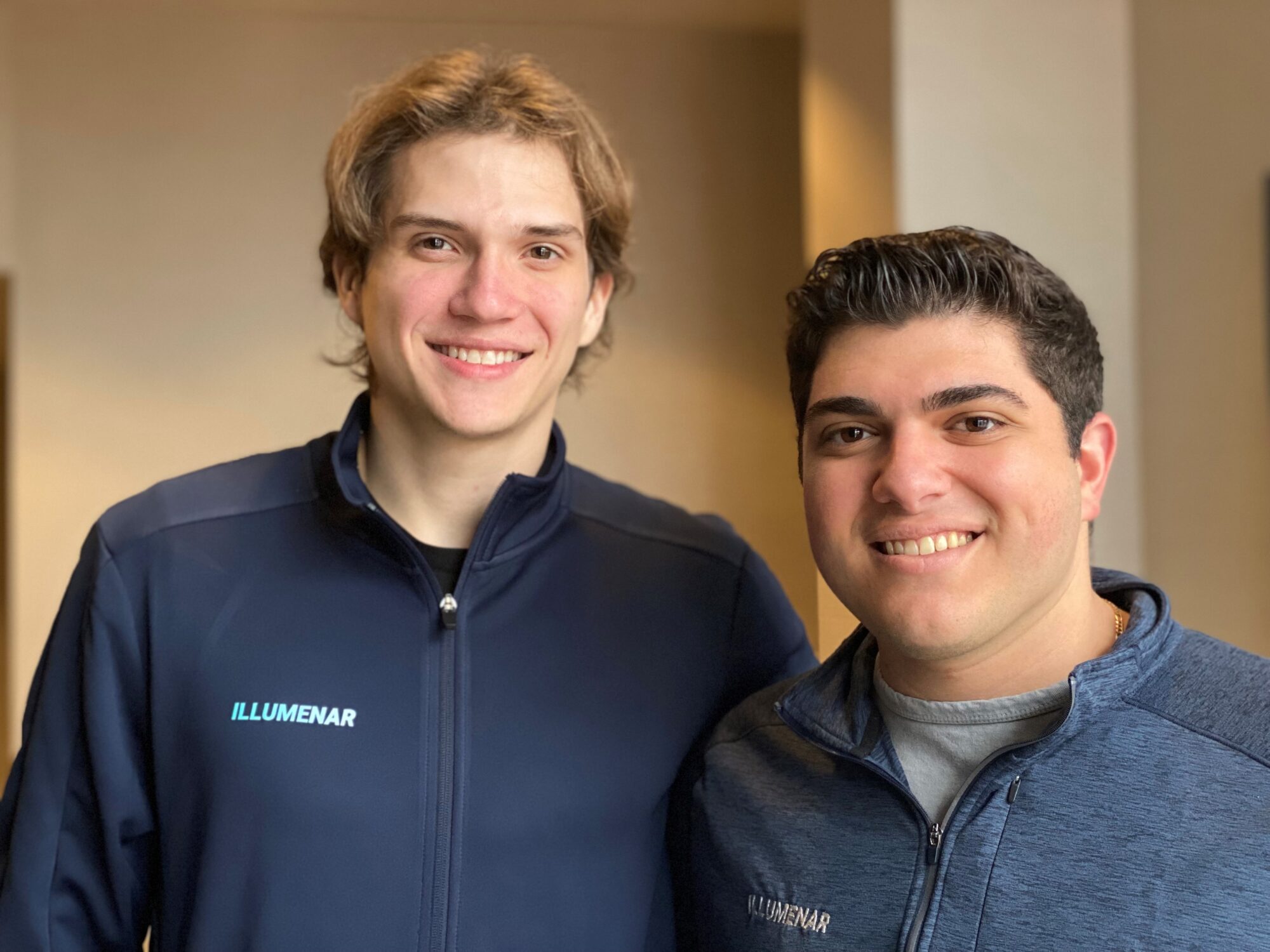 headshot of two student founders in company apparel
